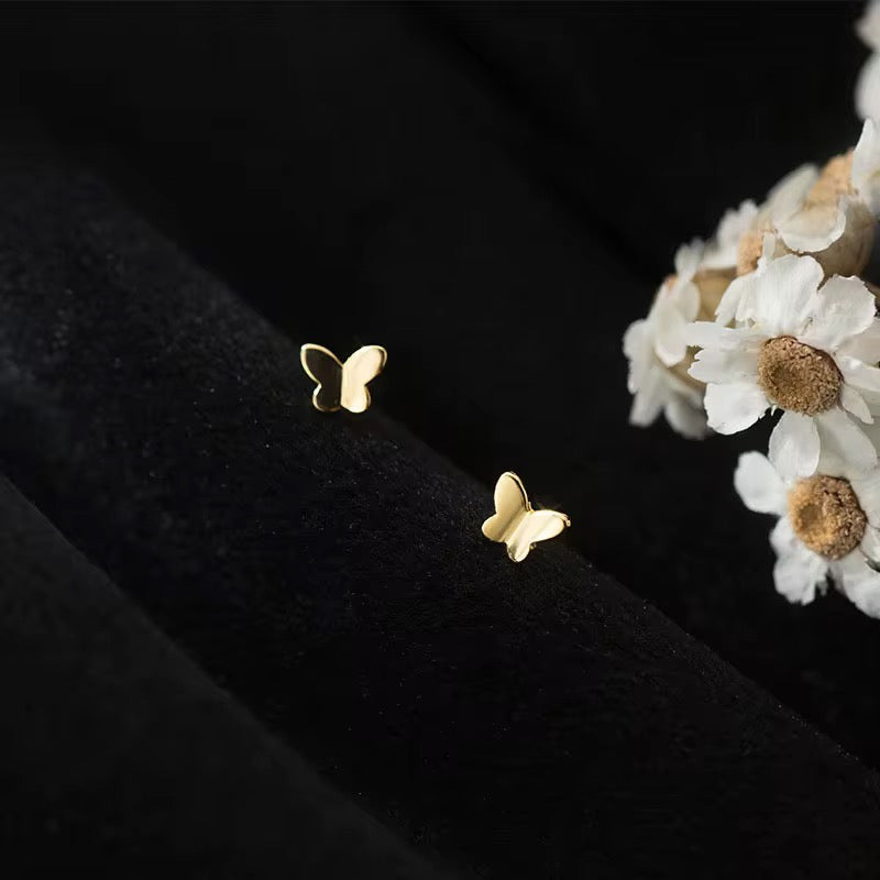 Tiny butterfly gold stud