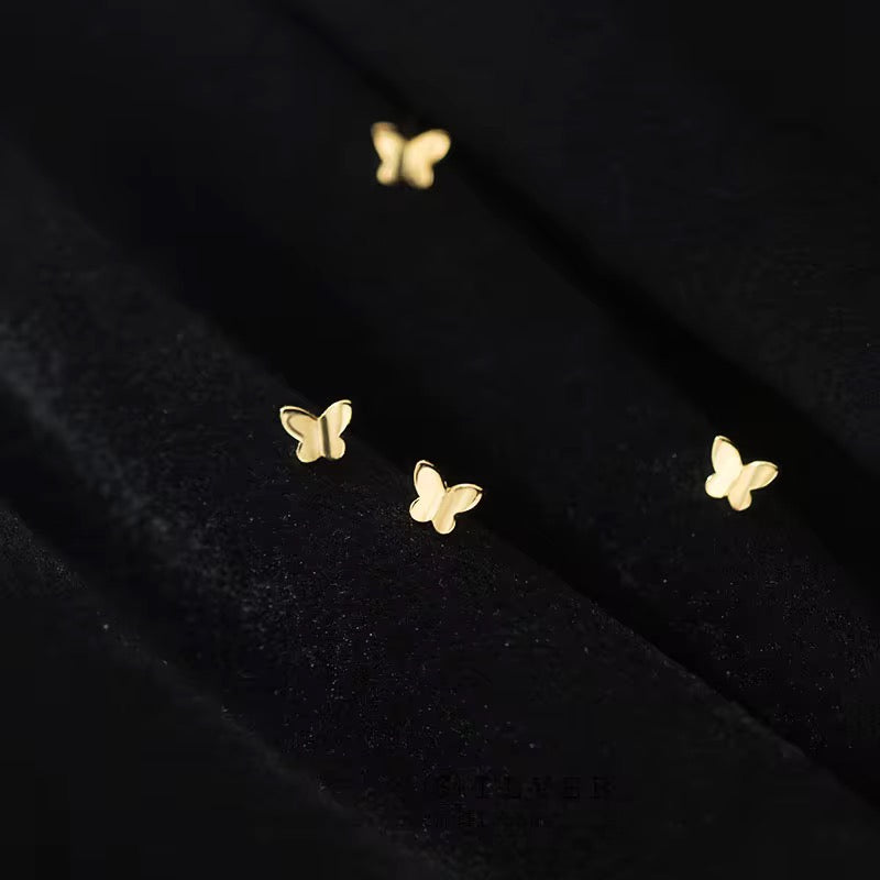 Tiny butterfly gold stud