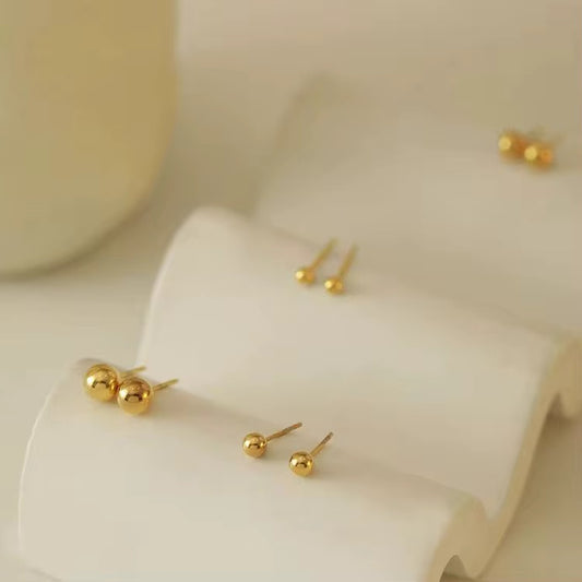 A trio of stud Earrings
